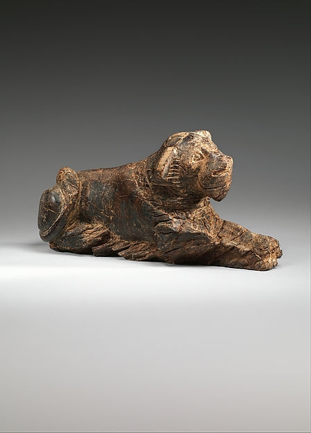 Ancient Egyptian ivory game piece carved in the form of a reclining lion, Early Dynastic period, of the type used in the Mehen serpent game (The Metropolitan Museum of Art).