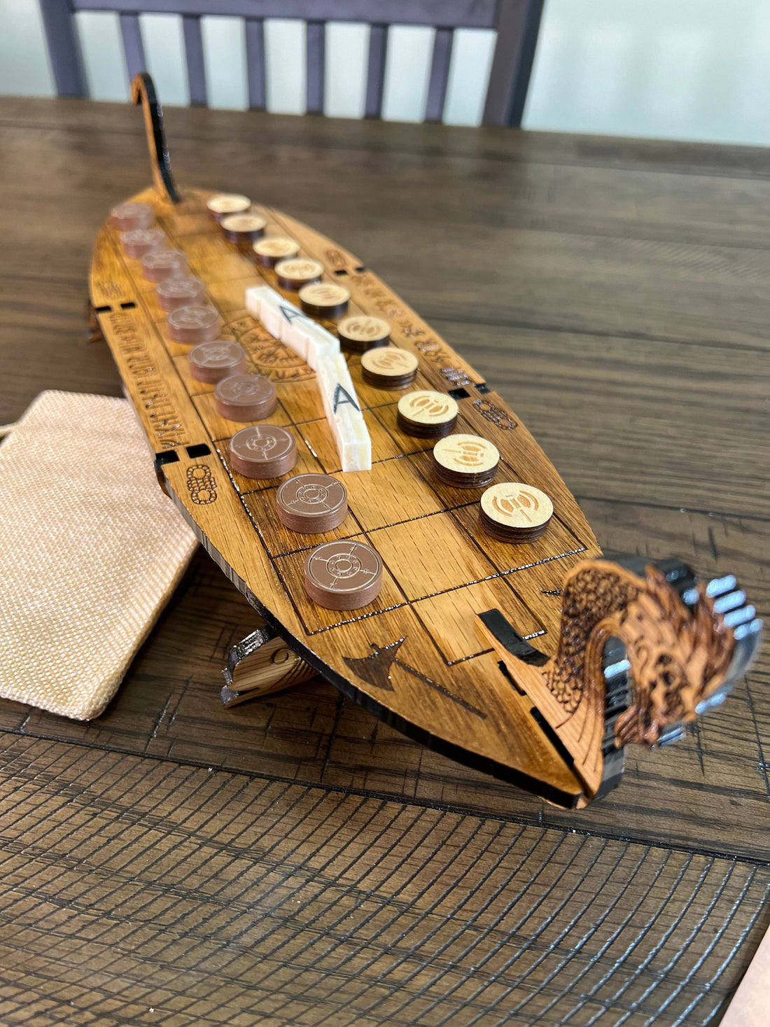 Handcrafted wooden Viking Daldos board game with bone four-sided dice